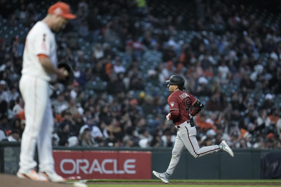 Arizona Diamondbacks' Alek Thomas, right, runs the bases after hitting a solo home run against San Francisco Giants pitcher Alex Cobb, foreground, during the sixth inning of a baseball game Tuesday, Aug. 1, 2023, in San Francisco. (AP Photo/Godofredo A. Vásquez)