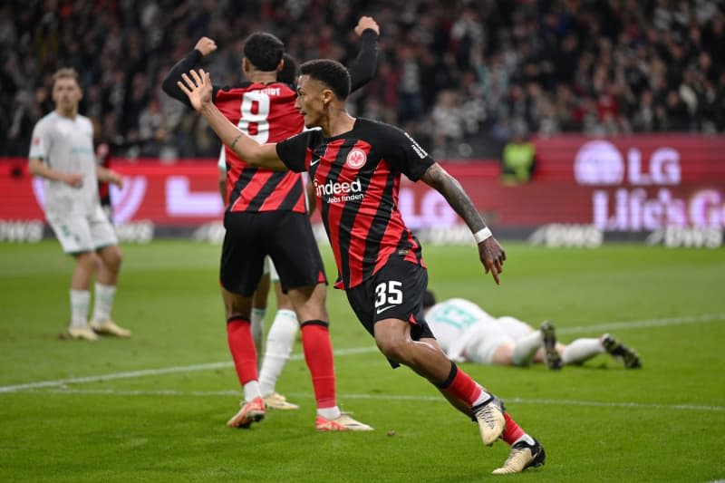 Frankfurt's Tuta celebrates after scoring his side's first goal during the German Bundesliga soccer match between Eintracht Frankfurt and SV Werder Bremen at Deutsche Bank Park. Arne Dedert/dpa