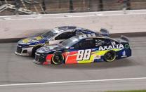 May 11, 2019; Kansas City, KS, USA; NASCAR Cup Series driver Alex Bowman (88) and Chase Elliott (9) race during the Digital Ally 400 at Kansas Speedway. Mandatory Credit: Jasen Vinlove-USA TODAY Sports