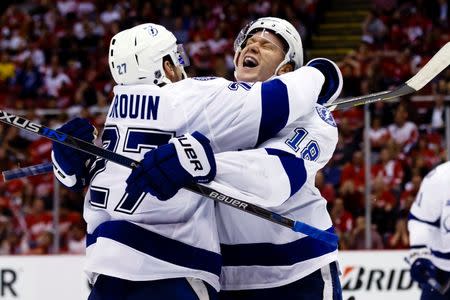 Apr 19, 2016; Detroit, MI, USA; Tampa Bay Lightning left wing Ondrej Palat (18) celebrates his goal during the third period with left wing Jonathan Drouin (27) in game four of the first round of the 2016 Stanley Cup Playoffs against the Detroit Red Wings at Joe Louis Arena. Tampa won 3-1. Rick Osentoski-USA TODAY Sports