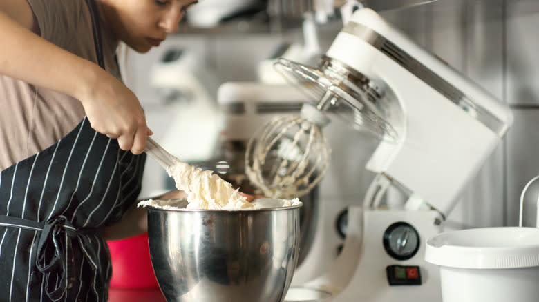 woman using stand mixer