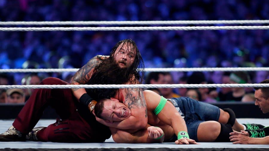 John Cena, right, and Bray Wyatt, left, compete during Wrestlemania XXX at the Mercedes-Benz Super Dome in New Orleans on Sunday, April 6, 2014. (Jonathan Bachman/AP Images for WWE)