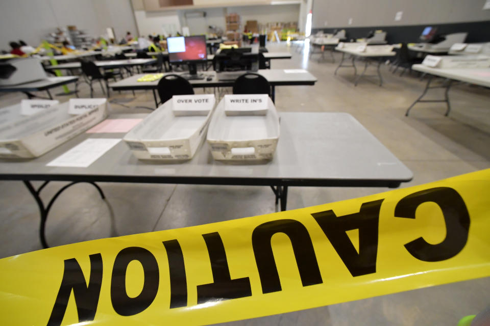 FILE - In this Tuesday, Nov. 24, 2020, file, photo, Cobb County Election officials prepare for a recount of ballots in Marietta, Ga. The Georgia State Election Board is asking a judge to order Texas-based True the Vote group, a conservative voting organization, to produce information to help investigate its claims of ballot trafficking in the state. In the court filing Tuesday, July 11, 2023,the state attorney general’s office asked a Fulton County Superior Court judge to order True the Vote to comply with its subpoena. (AP Photo/Mike Stewart)