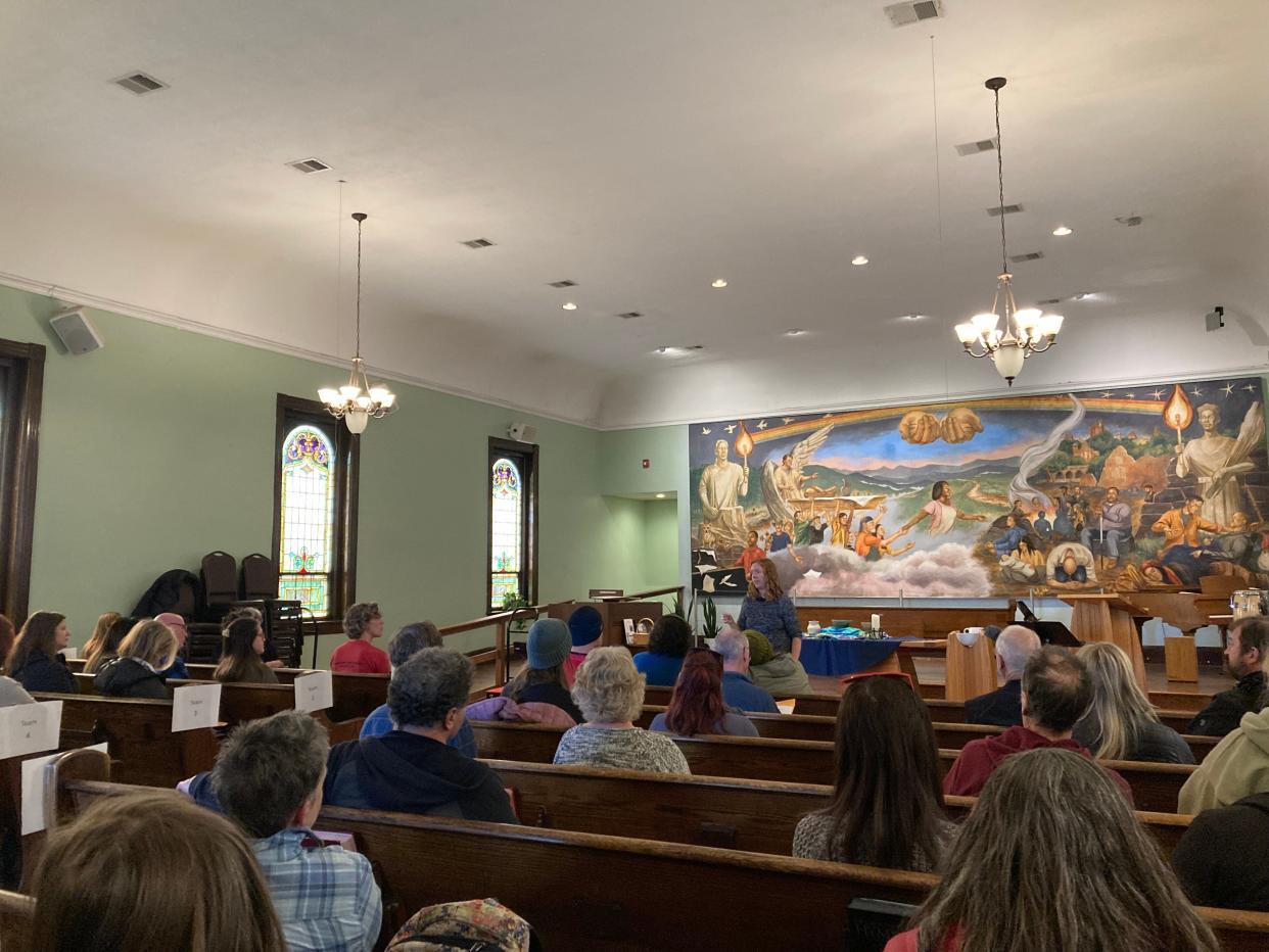 Debbie Alford, with city's Homeless Strategy Division addressed the assembled volunteers at Haywood Street Congregation.