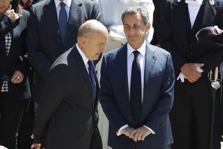 Former French Prime Minister Alain Juppe (L) and former French president Nicolas Sarkozy (R) pictured together in Paris on July 7, 2016