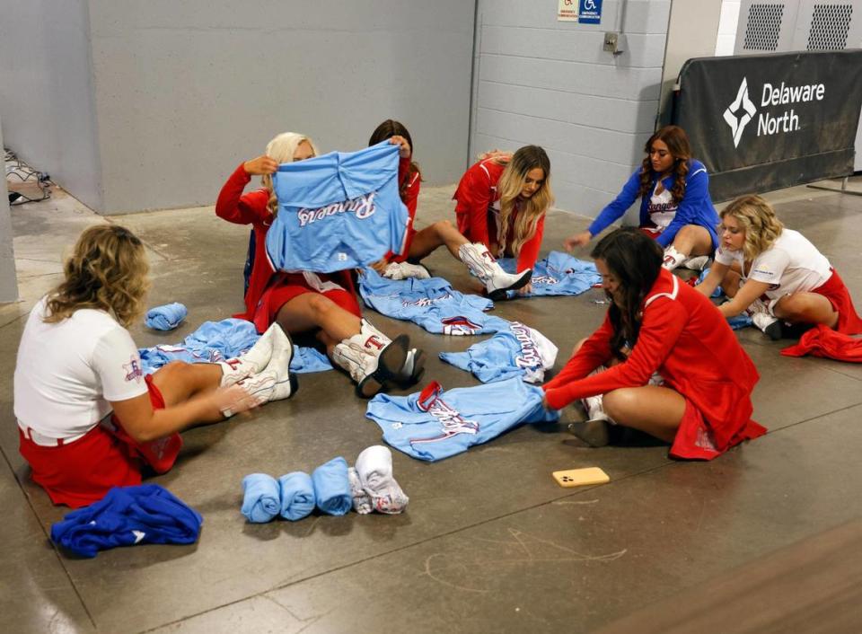 The Six Shooters roll jerseys to toss during the Texas Rangers World Series Parade in Arlington, Texas, Friday, Nov. 03, 2023. (Special to the Star-Telegram Bob Booth)