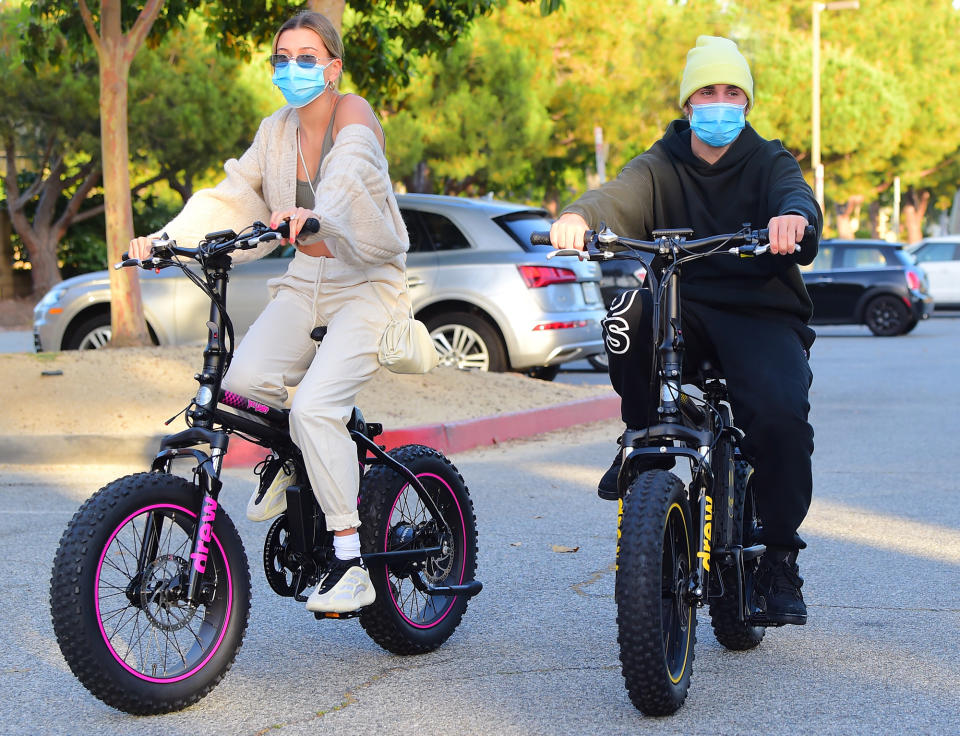 <p>Justin Bieber and Hailey Baldwin don masks for a joint bike ride in Los Angeles on Monday.</p>