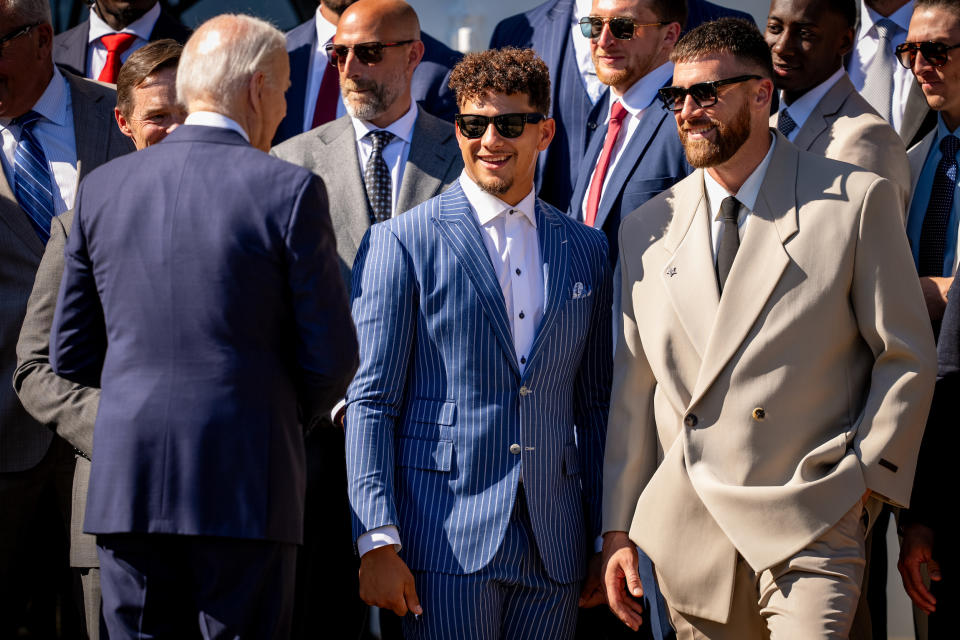 WASHINGTON, DC - MAY 31: U.S. President Joe Biden (L) greets NFL Kansas City Chiefs quarterback Patrick Mahomes (C) and tight end Travis Kelce in a Fear of God suit (R), following an event on the South Lawn of the White House on May 31, 2024 in Washington, DC. President Biden hosted the Chiefs to honor their 2024 Super Bowl win. (Photo by Andrew Harnik/Getty Images)