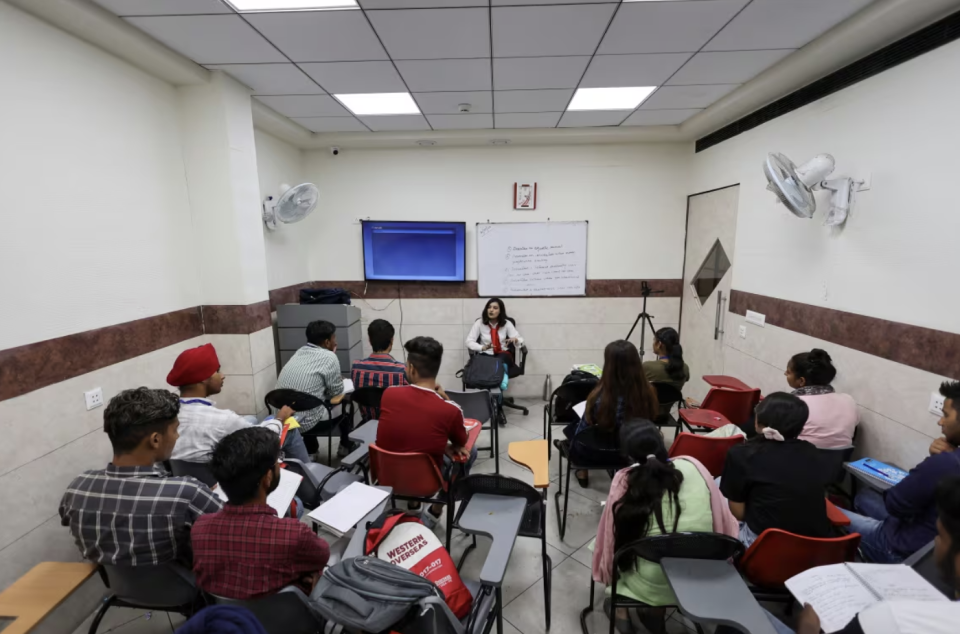 Students attend an international English language testing system class conducted by Western Overseas, an institute providing coaching for English language proficiency tests and visa consultancy, in Ambala, India, on Aug. 4, 2022. (Anushree Fadnavis/Reuters)