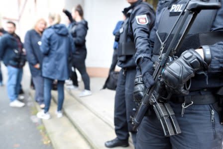 Police guard an entrance of the court before the start of a trial of five suspected Islamist militants, led by 33-year-old Iraqi known as Abu Walaa, accused of recruiting fighters for Islamic State in Syria, in Celle, Germany September 26, 2017. REUTERS/Fabian Bimmer