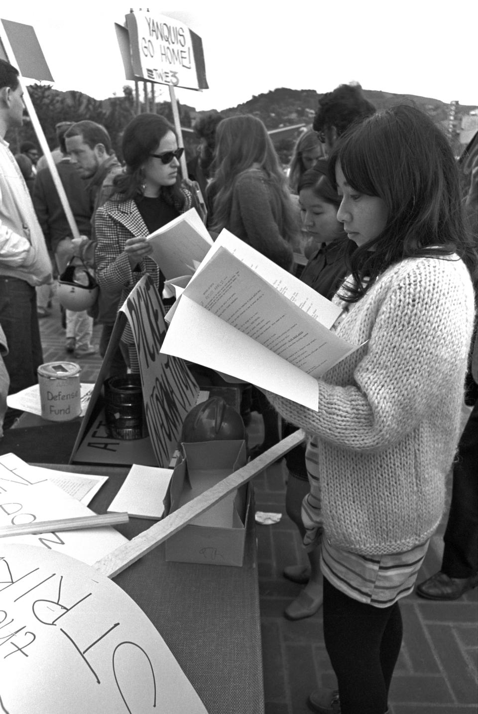 An unidentified student reads from an informational packet during a demonstration on the campus of the University of California