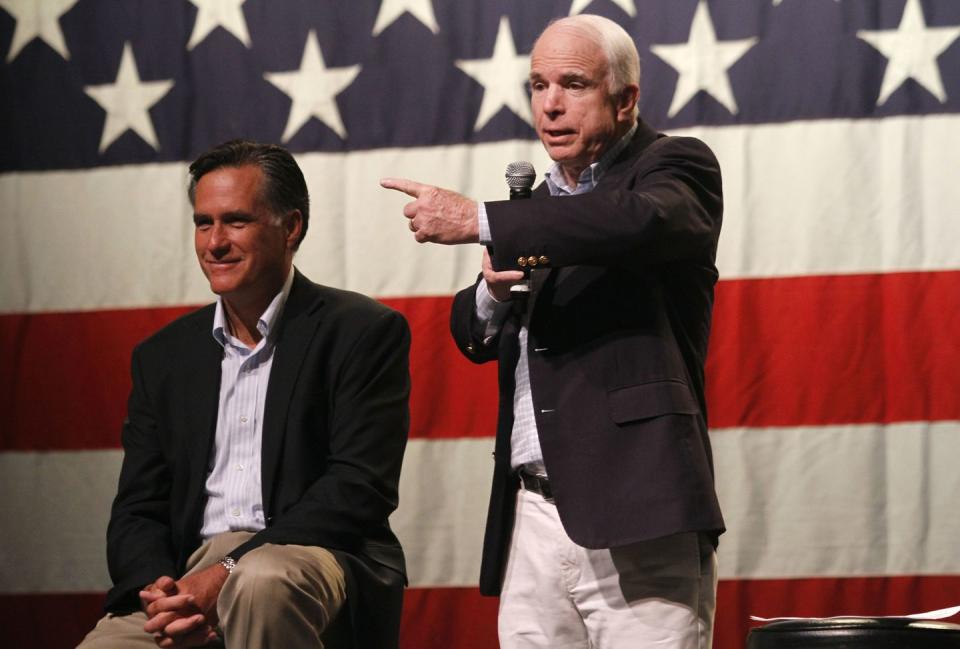 <p>McCain is joined by former Massachusetts Republican governor Mitt Romney as he speaks during a town hall meeting during a campaign stop at Mesa High School June 4, 2010 in Mesa, Arizona.</p>