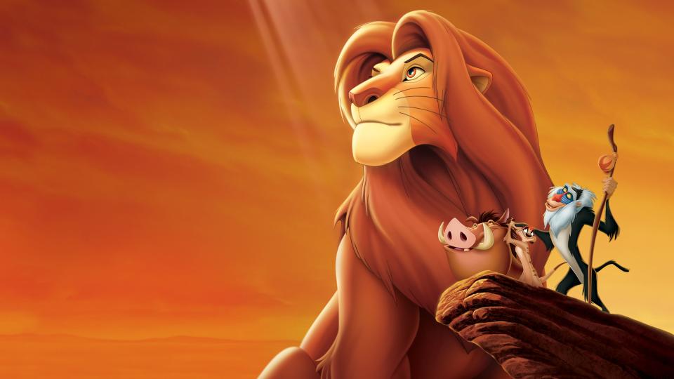 Simba, Pumba, Timon and Rafiki look into the distance in an iconic image from The Lion King