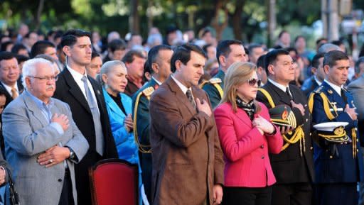 New Paraguayan President Federico Franco (C), accompanied by his wife Emilia Alfaro (C-R), attends a mass for peace at the Metropolitan Cathedral in Asuncion