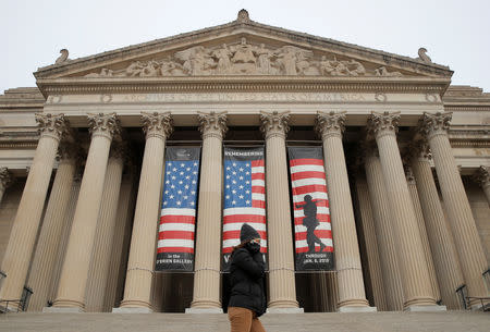 A woman walks past the entrance to the National Archives which is closed due to a partial government shutdown continues, in Washington, U.S., January 7, 2019. REUTERS/Jim Young
