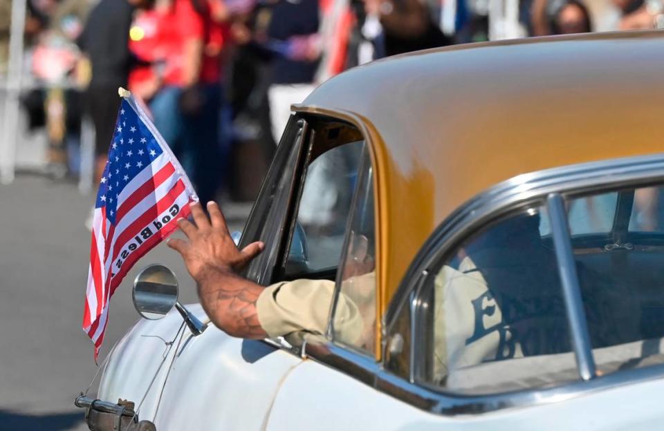 Classic cars pass Fresno City Hall joining the annual Central Valley Veterans Day Parade held Saturday, Nov. 11, 2023 in downtown Fresno.