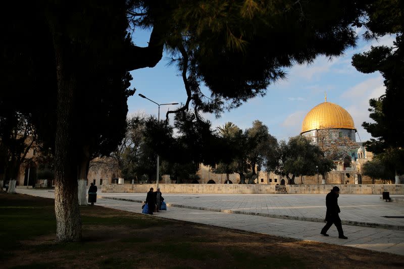 The Dome of the Rock is seen in the background as people visit the compound known to Jews as Temple Mount and to Muslims as Noble Sanctuary, in Jerusalem's Old City