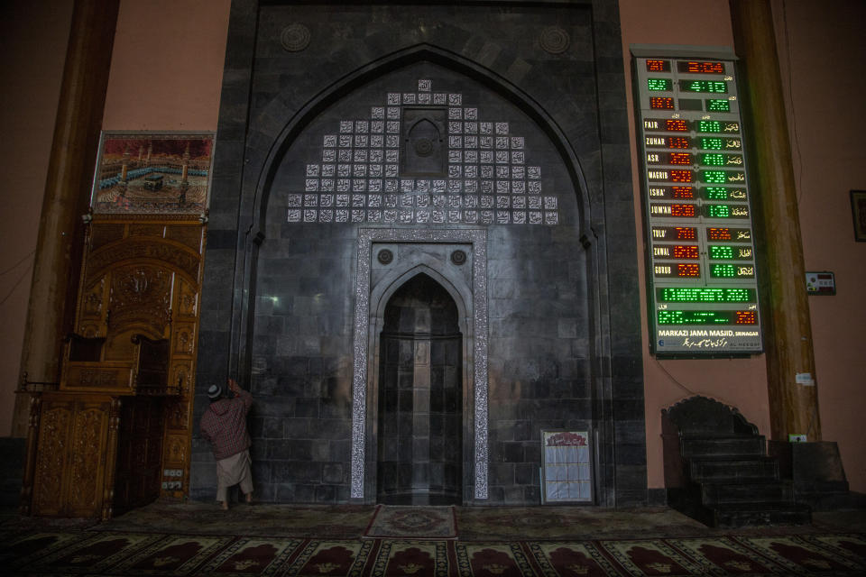 A care taker cleans the Jamia Masjid, or the grand mosque in Srinagar, Indian controlled Kashmir, Nov. 13, 2021. The mosque has remained out of bounds to worshippers for prayers on Friday – the main day of worship in Islam. Indian authorities see it as a trouble spot, a nerve center for anti-India protests and clashes that challenge New Delhi’s sovereignty over disputed Kashmir. For Kashmiri Muslims it is a symbol of faith, a sacred place where they offer not just mandatory Friday prayers but also raise their voice for political rights. (AP Photo/Mukhtar Khan)