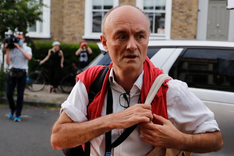 <p>Enemies in high places: Cummings outside his home</p> (AFP via Getty Images)