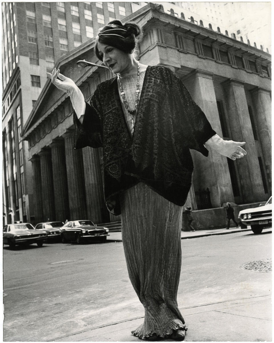 This photo provided by the New-York Historical Society shows the photographer Bill Cunningham's muse Editta Sherman wearing a costume ca. 1910, in front of Federal Hall, which was built ca. 1842, in New York. The photo is one of 88 prints from Bill Cunningham’s 1976-1978 project, “Facades,” featured in an exhibition at the New-York Historical Society, running through June 15, 2014. The images are a whimsical photo essay in which Cunningham posed models in period costumes against famous New York City historic sites of the same vintage. (AP Photo/New-York Historical Society, Gift of Bill Cunningham)