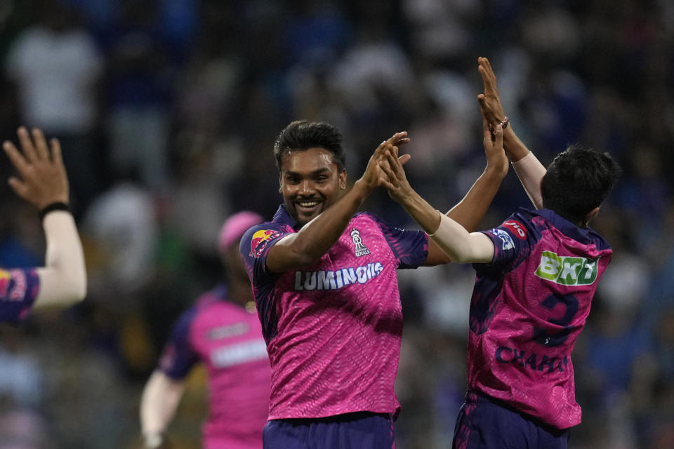 Rajasthan Royals's Sandeep Sharma center, celebrates the dismissal of Mumbai Indian's captain Rohit Sharma with his team players during the Indian Premier League cricket match between Mumbai Indians and Rajasthan Royals in Mumbai, India, Sunday, April 30, 2023. (AP Photo/Rajanish Kakade)