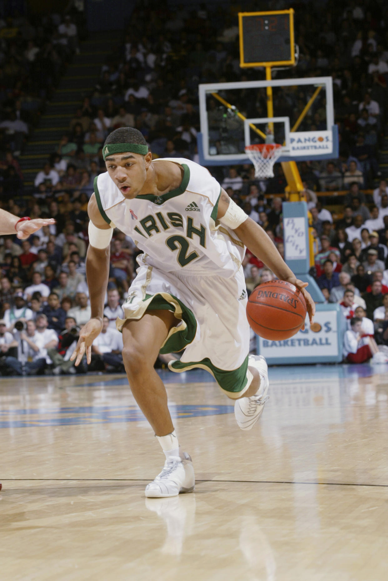  Romeo Travis #24 of St. Vincent-St. Mary High School moves the ball forward against Mater Dei High School during the Ninth Pangos Dream Classic at Pauley Pavilion on the UCLA campus on January 4, 2003 in Los Angeles, California.  St. Vincent-St. Mary won 64-58.  (Photo by Stephen Dunn/Getty Images)