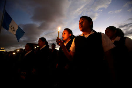 A vigil for victims after a fire broke out at the Virgen de Asuncion home in San Jose Pinula, on the outskirts of Guatemala City, March 9, 2017. REUTERS/Saul Martinez