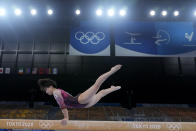 FILE - In this July 25, 2021, file photo, , of Japan, performs on the balance beam during the women's artistic gymnastic qualifications at the 2020 Summer Olympics, in Tokyo. Murakami said she was thrilled that her home country hosted the Olympics because she hoped many of her admirers could see her perform in person. She was devasted when even Japanese citizens were barred from attending. (AP Photo/Natacha Pisarenko, File)