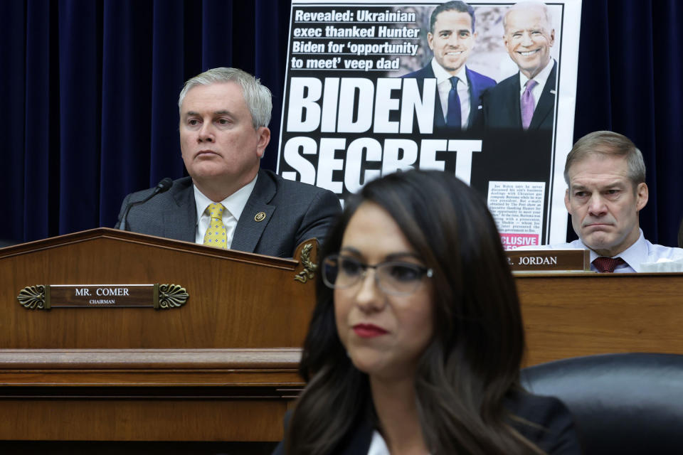 With a poster of a New York Post front page story about Hunter Biden’s emails on display, Committee Chairman Rep. James Comer (R-KY), Rep. Jim Jordon (R-OH) and Rep. Lauren Boebert (R-CO) listen during a hearing before the House Oversight and Accountability Committee at Rayburn House Office Building on Capitol Hill on Feb. 8, 2023.<span class="copyright">Alex Wong—Getty Images</span>