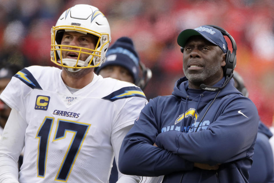FILE - In this Sunday, Dec. 29, 2019, file photo, Los Angeles Chargers coach Anthony Lynn stands next to quarterback Philip Rivers during the second half of the team's NFL football game against the Kansas City Chiefs in Kansas City, Mo. Los Angeles — which was 5-11 last season after making the playoffs in 2018 — will have a new quarterback after it announced in February that it would not re-sign Rivers. Lynn and Chargers quarterback Tyrod Taylor were together in Buffalo for two seasons. (AP Photo/Charlie Riedel, File)