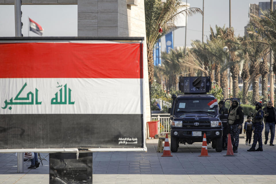 Iraqi security forces stationed by the Freedom Monument in Baghdad's Tahrir Square on Dec. 26, 2023. Iraq denounced U.S. airstrikes in the country as a 