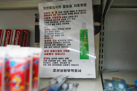 A poster advertises a kind of North Korean toothpaste said to whiten teeth and ease skin irritation in a Pyongyang hotel shop, North Korea May 4, 2016. REUTERS/James Pearson