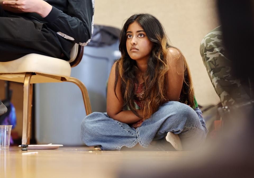 Aarmila Hai listens as others talk during an after performance party with Hawaiian poet Kealoha Wong in the West Valley Performing Arts Center on Thursday, June 29, 2023. Wong conducted a five-week intensive arts program for high-school and college-aged youth with a special invitation to Pacific Islander, BIPOC and LGBTQ youth from Salt Lake County. | Scott G Winterton, Deseret News