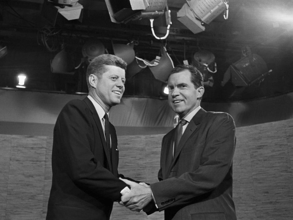 1960 presidential candidates John F. Kennedy and Richard Nixon shaking hands after their television debate.