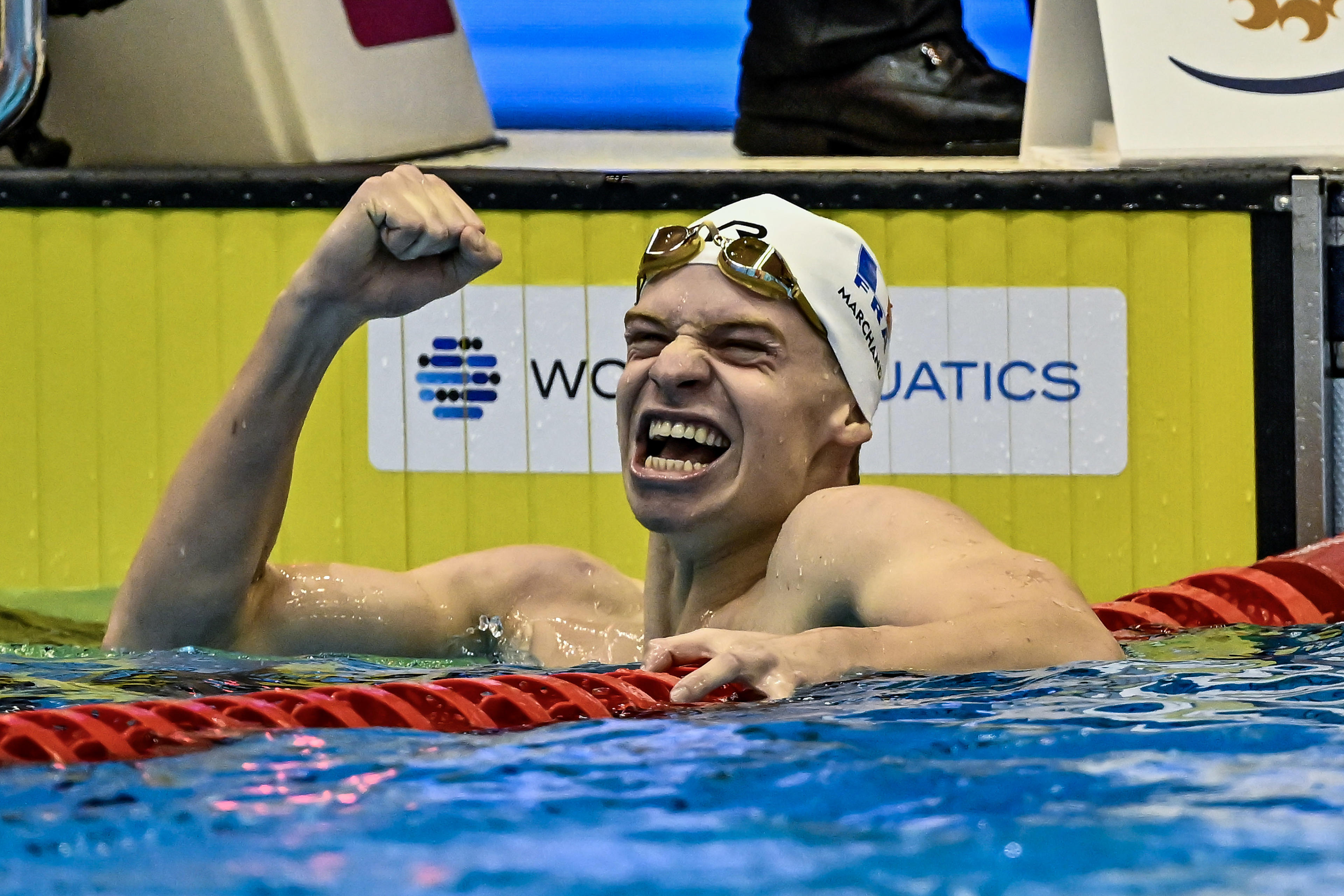 France's Leon Marchand celebrates winning gold and setting a world record in the 400IM at the 2023 World Championships.  (DBM/Insidefoto/Mondadori Portfolio, via Getty Images)