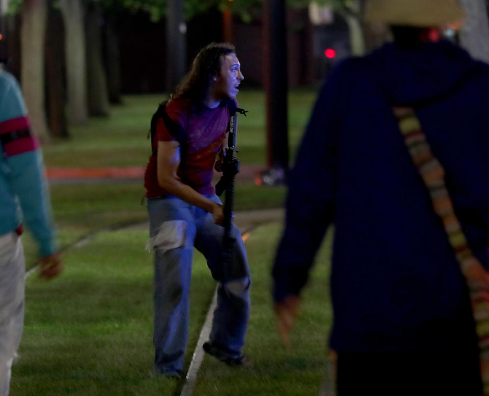 Aug 23, 2020; Kenosha, WI, USA; An armed man is seen outside the Kenosha County Courthouse in Kenosha on Sunday, Aug. 23, 2020. Kenosha police shot a man Sunday evening, setting off unrest in the city. Mandatory Credit: Mike De Sisti/Milwaukee Journal Sentinel via USA TODAY NETWORK/Sipa USA