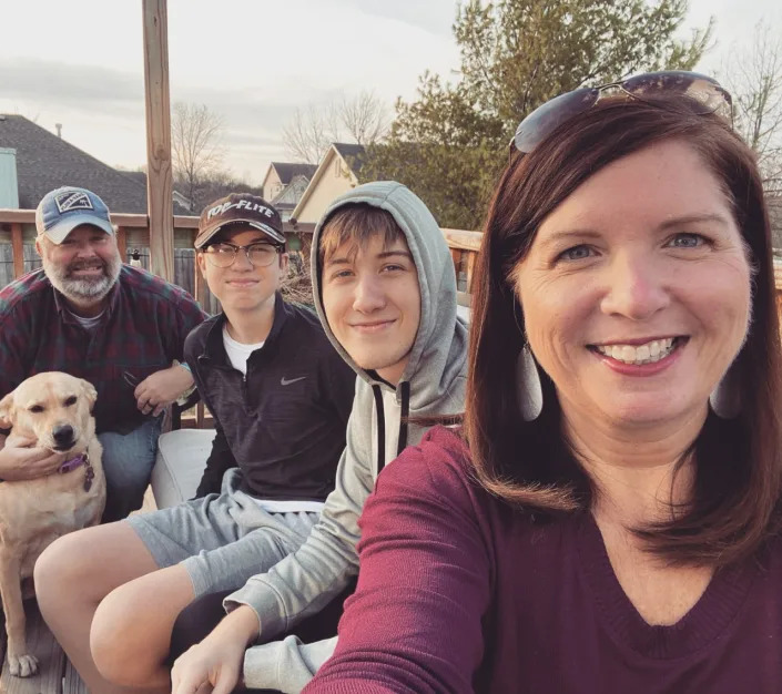 Devlin shares a happy moment with her sons Sean and Conor, her husband, Brandon, and Lulu the dog.  (Courtesy Andria Devlin)