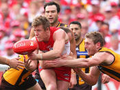 <p>Luke Parker in the grips of the Hawthorn defence.</p>