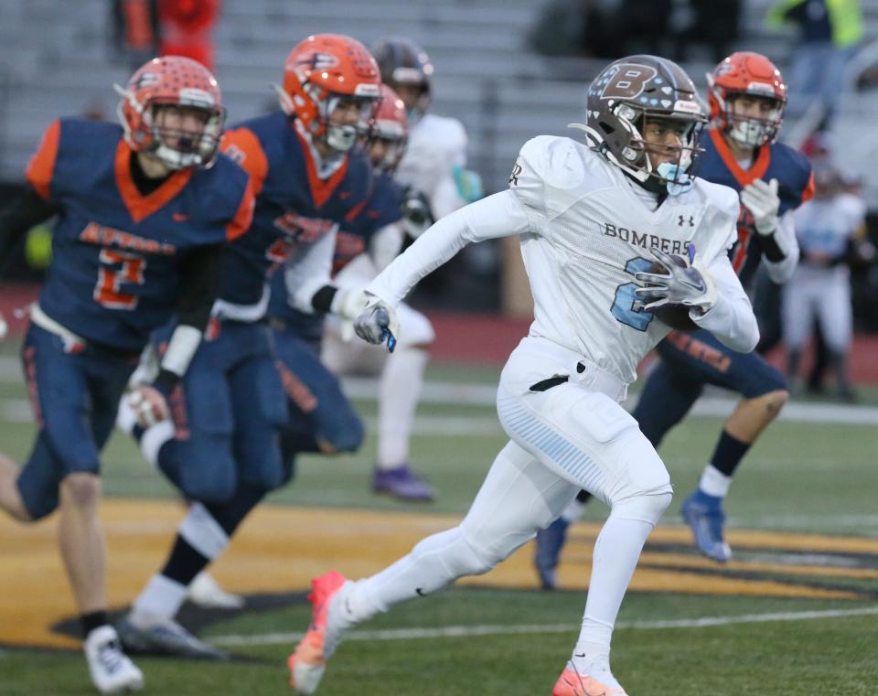 ER/Gananda's Michael Daniels (2) runs away from Attica's defense to score at the start of the second half during their Section V football Class C championship game Saturday, Nov. 12, 2022 at SUNY Brockport.