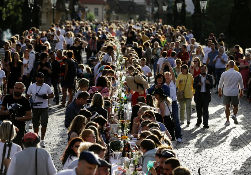FILE PHOTO: Residents dine at the medieval Charles Bridge in Prague