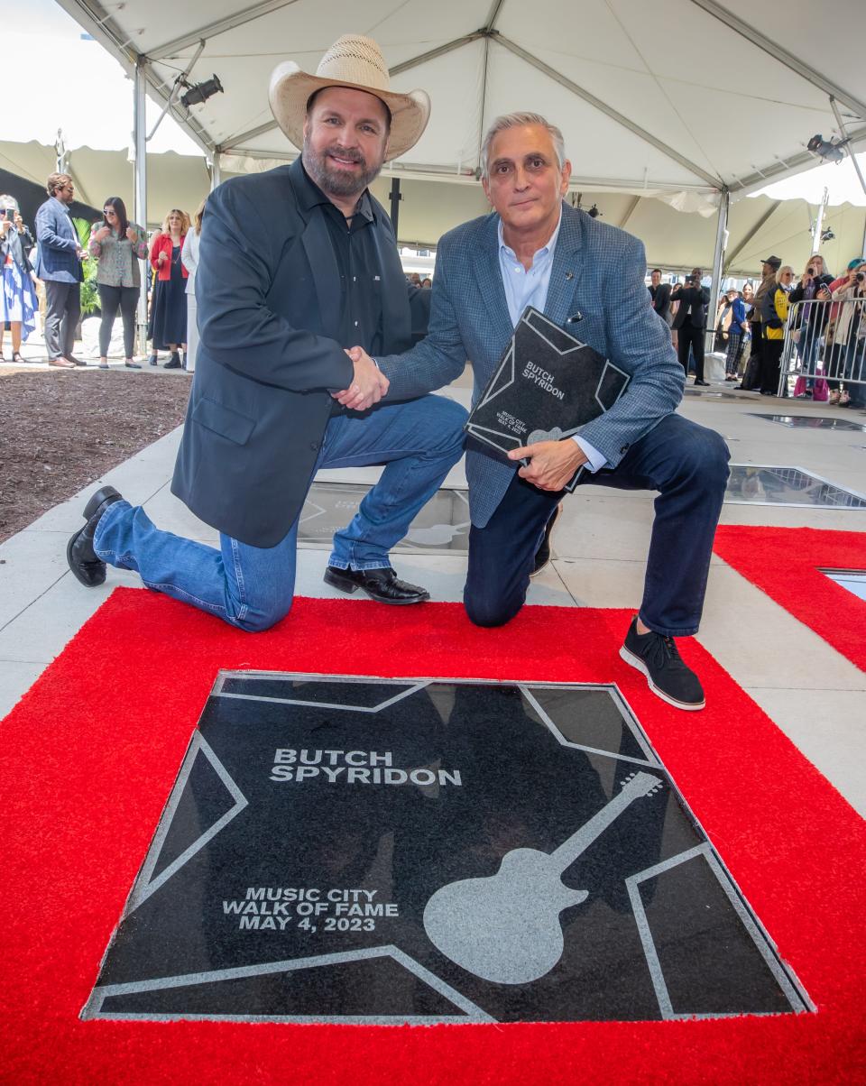 Garth Brooks with NCVC CEO Butch Spyridon, Music City Walk of Fame induction ceremony, May 4, 2023