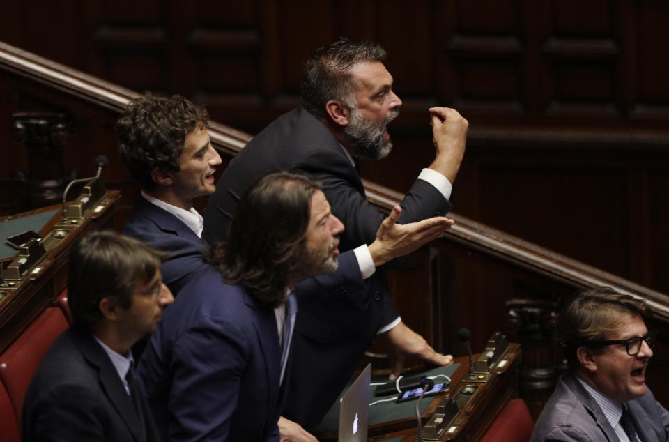 Right wing legislators shout their disapproval as Italian Premier Giuseppe Conte intervenes in the parliament debate ahead of confidence vote later at the Lower Chamber in Rome, Monday, Sept. 9, 2019. Conte is pitching for support in Parliament for his new left-leaning coalition ahead of crucial confidence votes. (AP Photo/Gregorio Borgia)