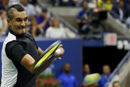 Nick Kyrgios of Australia hits a return to Andy Murray of Britain during their first round match at the U.S. Open Championships tennis tournament in New York, August 31, 2015. REUTERS/Shannon Stapleton