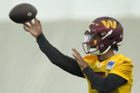 Washington Commanders first round draft pick quarterback Jayden Daniels warms up during an NFL rookie minicamp football practice in Ashburn, Va., Friday, May 10, 2024. (AP Photo/Susan Walsh)