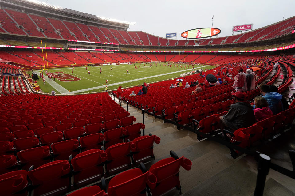 Fans watch the Kansas City Chiefs during NFL football training camp Saturday, Aug. 29, 2020, at Arrowhead Stadium in Kansas City, Mo. The Chiefs opened the stadium to 5,000 season ticket holders to watch practice as the team plans to open the regular season with a reduced capacity of approximately 22 percent of normal attendance. (AP Photo/Charlie Riedel)