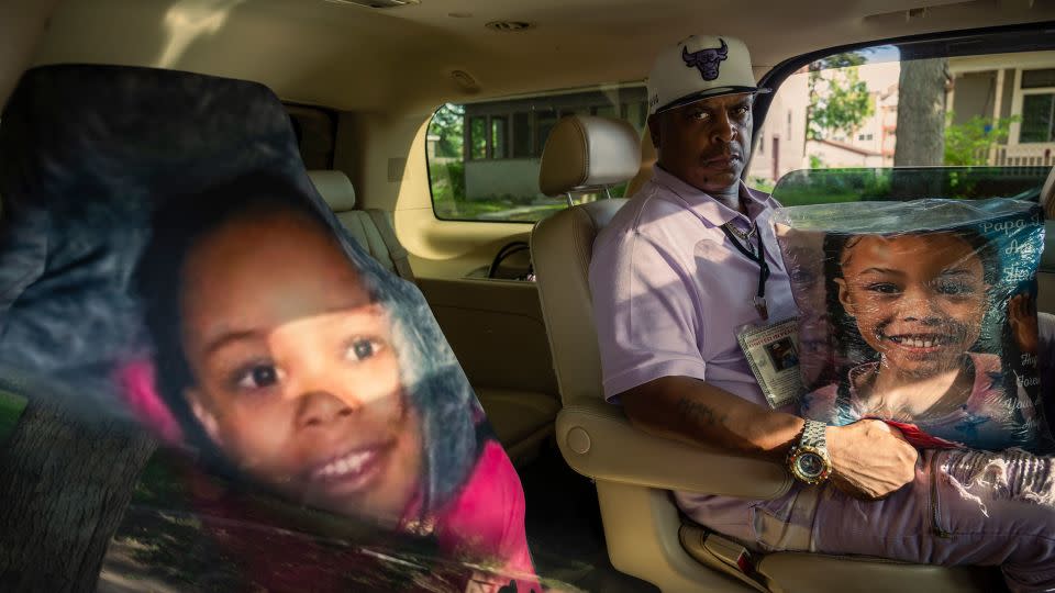 KG Wilson created a memorial for his granddaughter Aniya Allen in his SUV. The car seat cover of her face rests on the seat where she would ride with him.  - Andrea Ellen Reed for CNN