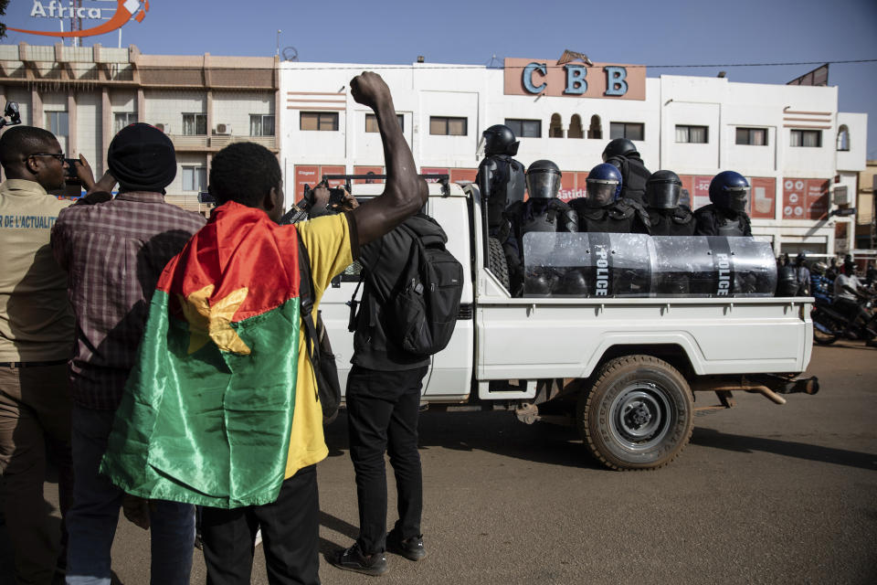 Protestors take to the streets of Burkina Faso's capital Ouagadougou Saturday Jan. 22, 2022, 27, 2021, protesting the government's inability to stop jihadist attacks spreading across the country and calling for President Roch Marc Christian Kabore to resign. (AP Photo/Sophie Garcia)