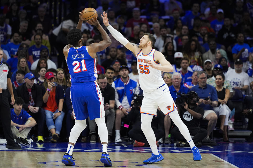 Philadelphia 76ers' Joel Embiid, left, looks to shoot against New York Knicks' Isaiah Hartenstein, right, during the first half of Game 6 in an NBA basketball first-round playoff series, Thursday, May 2, 2024, in Philadelphia. (AP Photo/Matt Slocum)