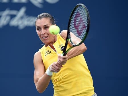 Aug 11, 2015; Toronto, Ontario, Canada; Flavia Pennetta of Italy hits a shot against Serena Williams of the United States (not pictured) during the Rogers Cup tennis tournament at Aviva Centre. Dan Hamilton-USA TODAY Sports