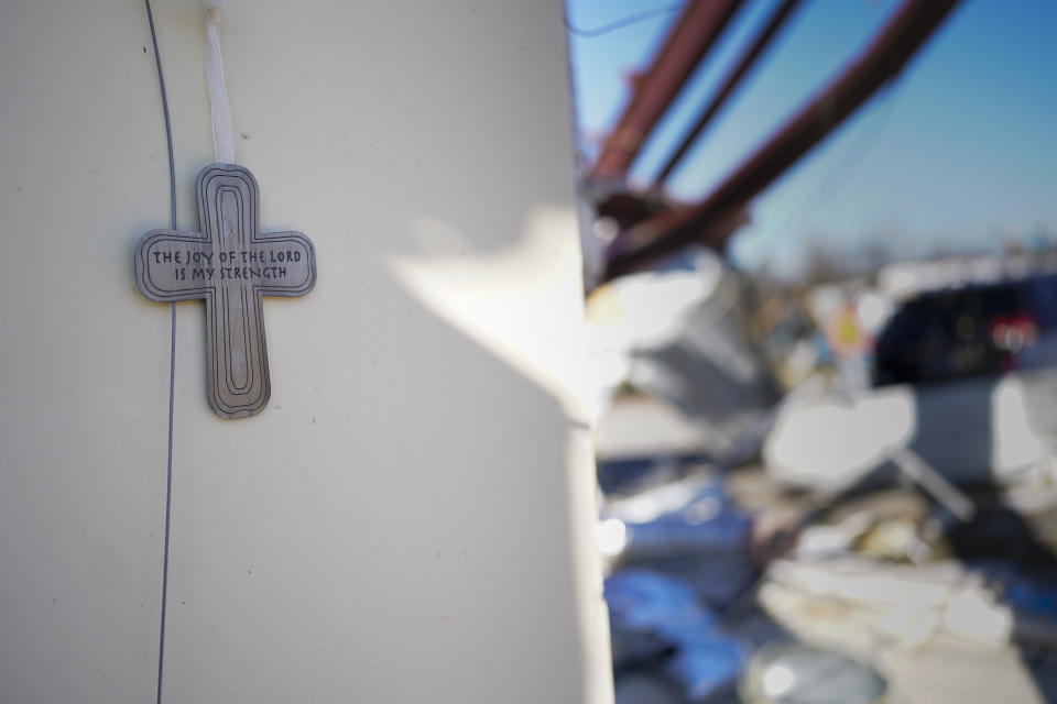 A cross is seen on a wall at Community Baptist Church, Monday, Dec. 11, 2023 in Nashville, Tenn. The church was demolished by severe storms that hit central Tennessee over the weekend. (AP Photo/George Walker IV)